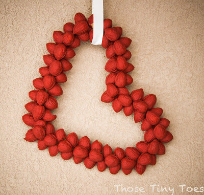 Can you believe that this DIY Valentine's Day Wreath by Those Tiny Toes is made out of, wait for it..... walnuts?!